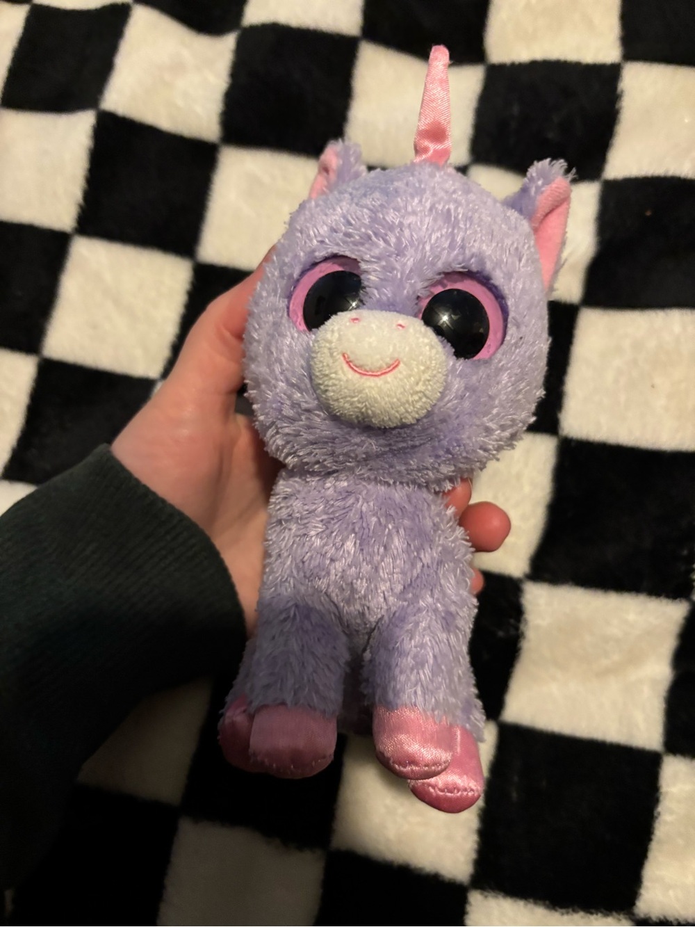 Rainbow the Unicorn, a retired purple plush from the Ty Beanie Boos collection